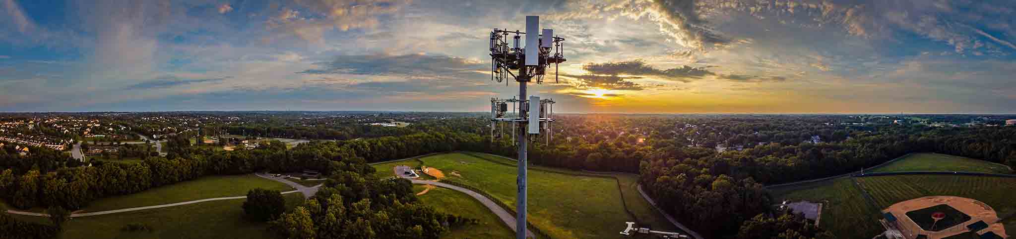 Panorama of mobile cell phone transmission tower on the hill